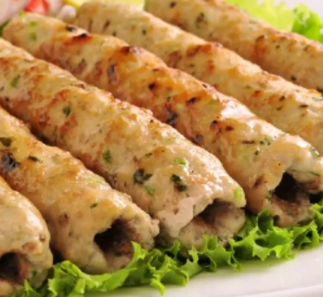 Grilled kebabs on a bed of lettuce