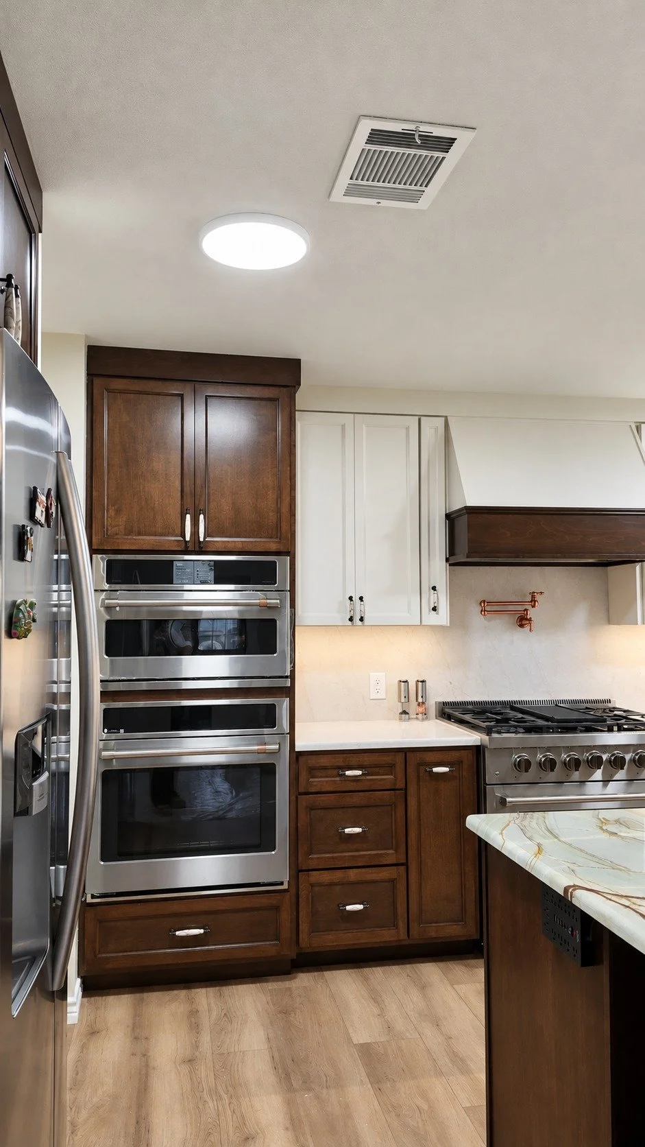 Built-in ovens and coordinated custom cabinetry.