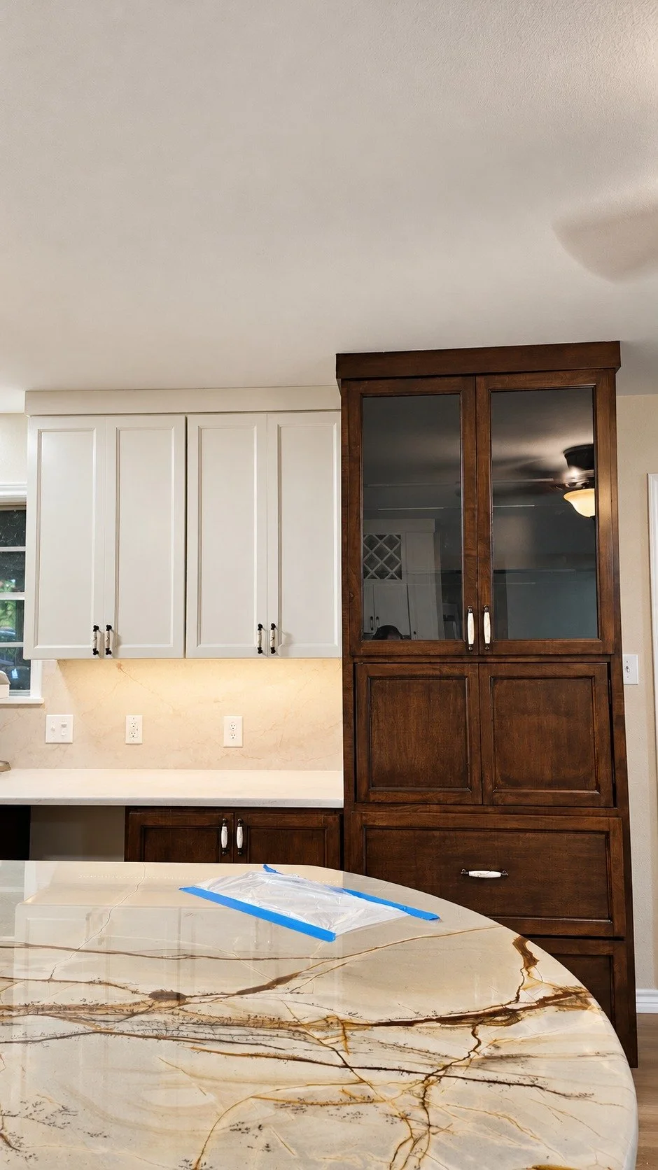 Coordinated cabinetry and naturally patterned stone.