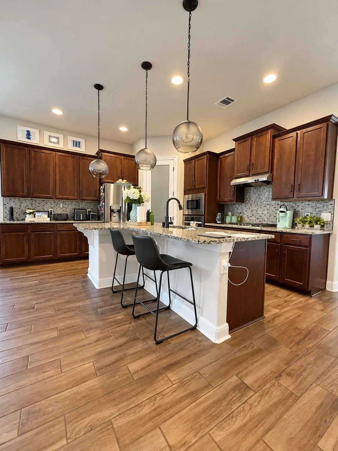 Before — the original dark cabinetry and central island.