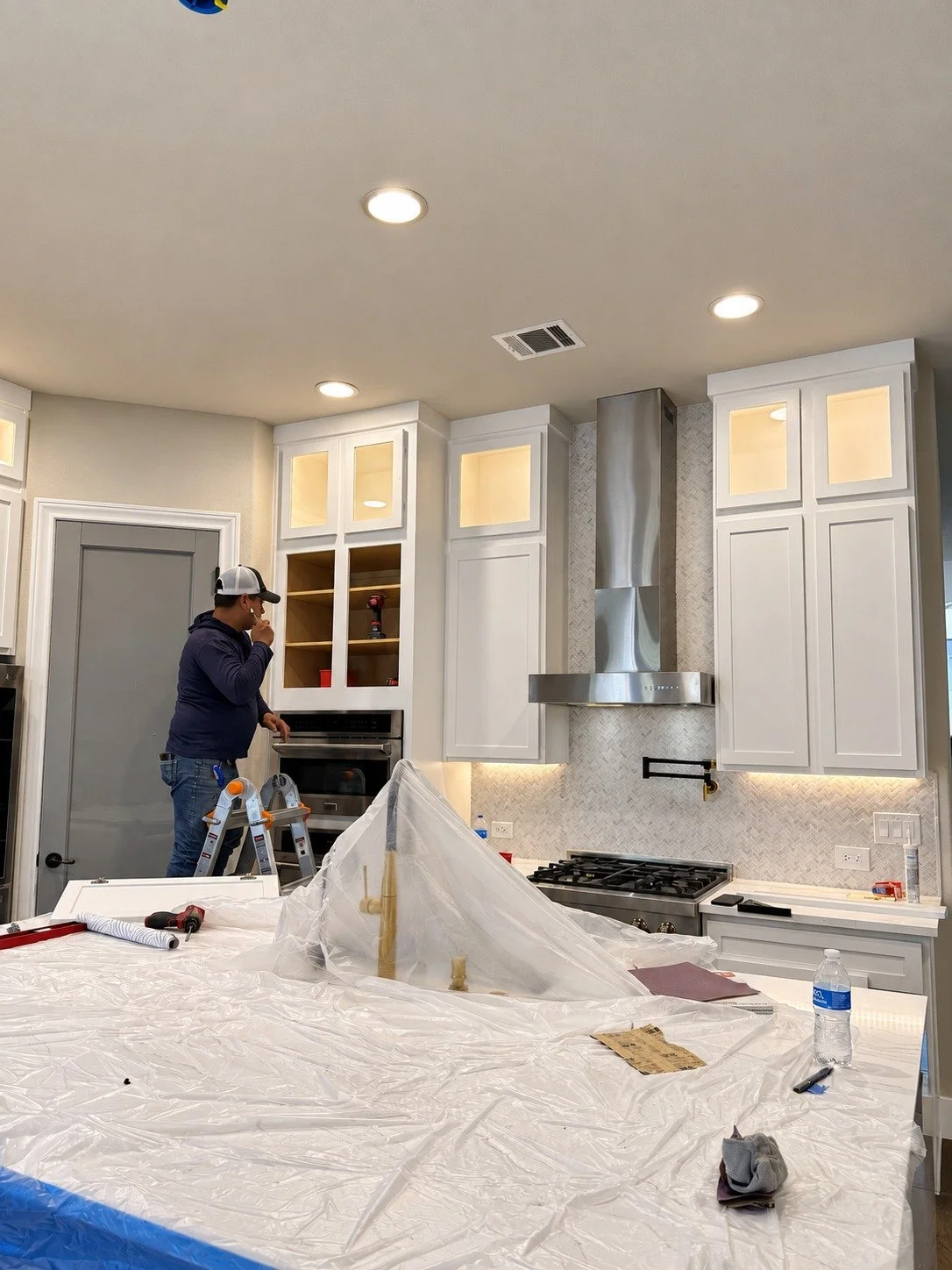 Work in progress — fitting the cabinetry during the remodel.