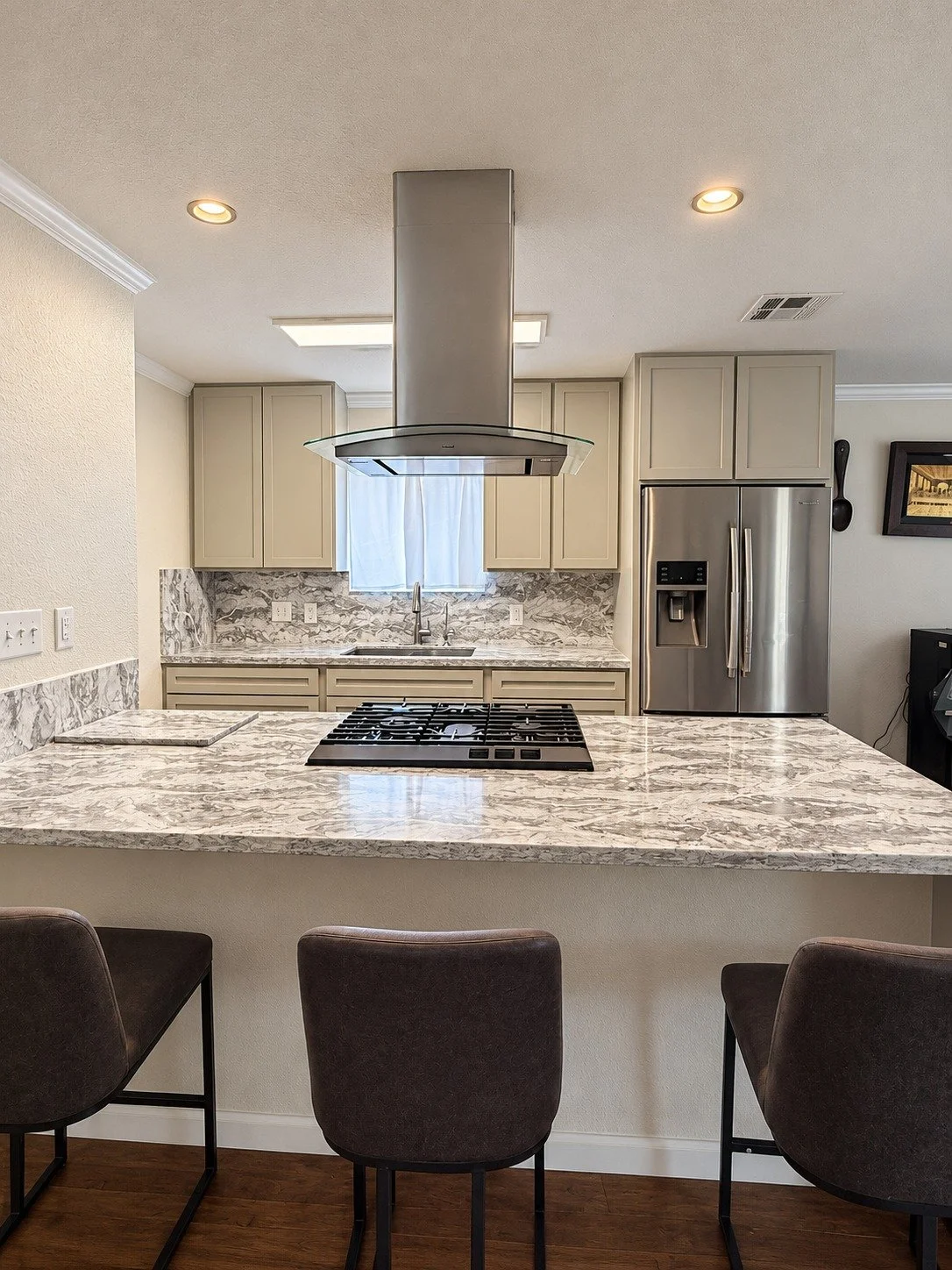The kitchen island brings seating and cooking space together.