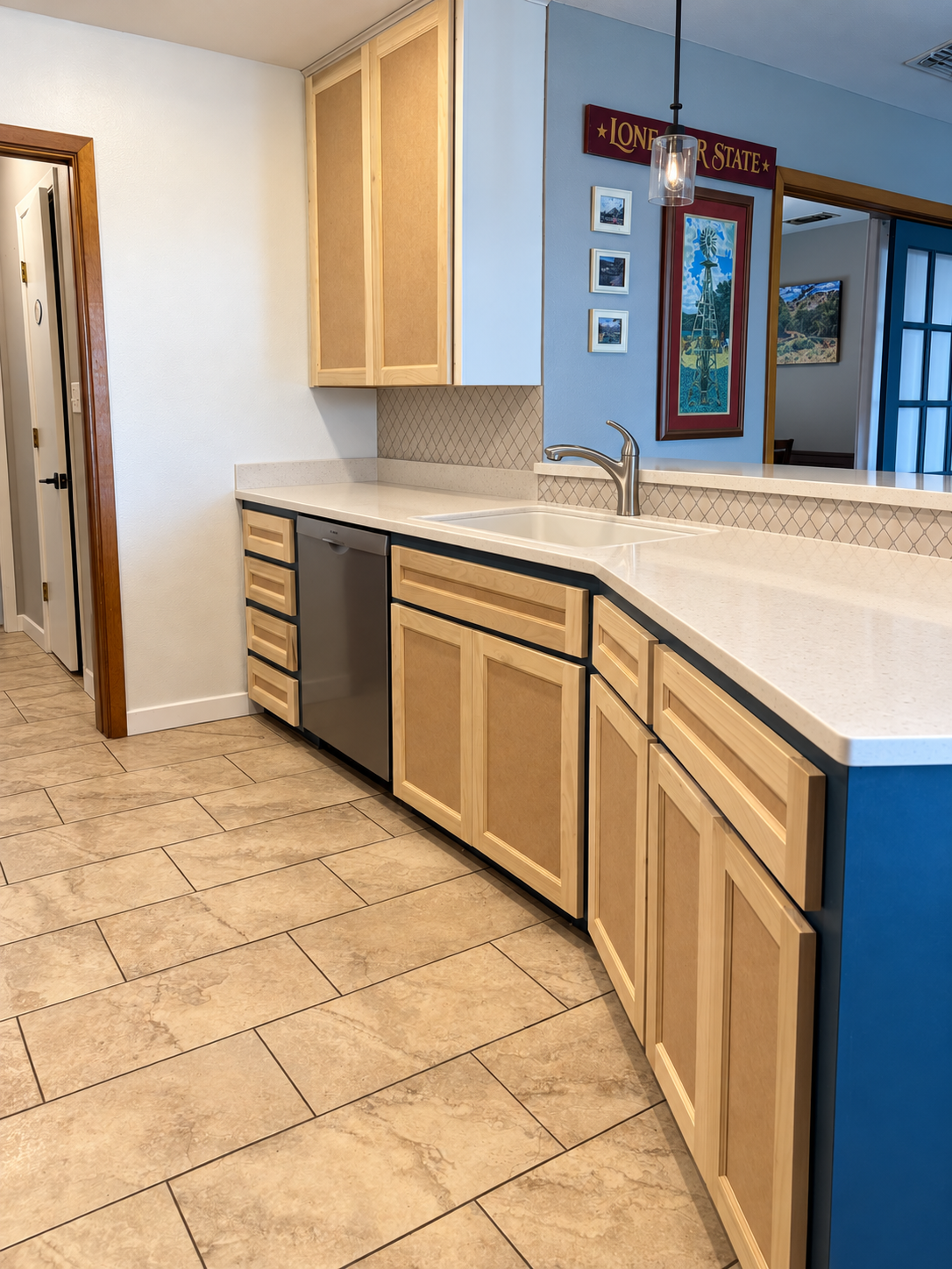 New cabinet fronts along the sink and dishwasher, shown before the final finish.
