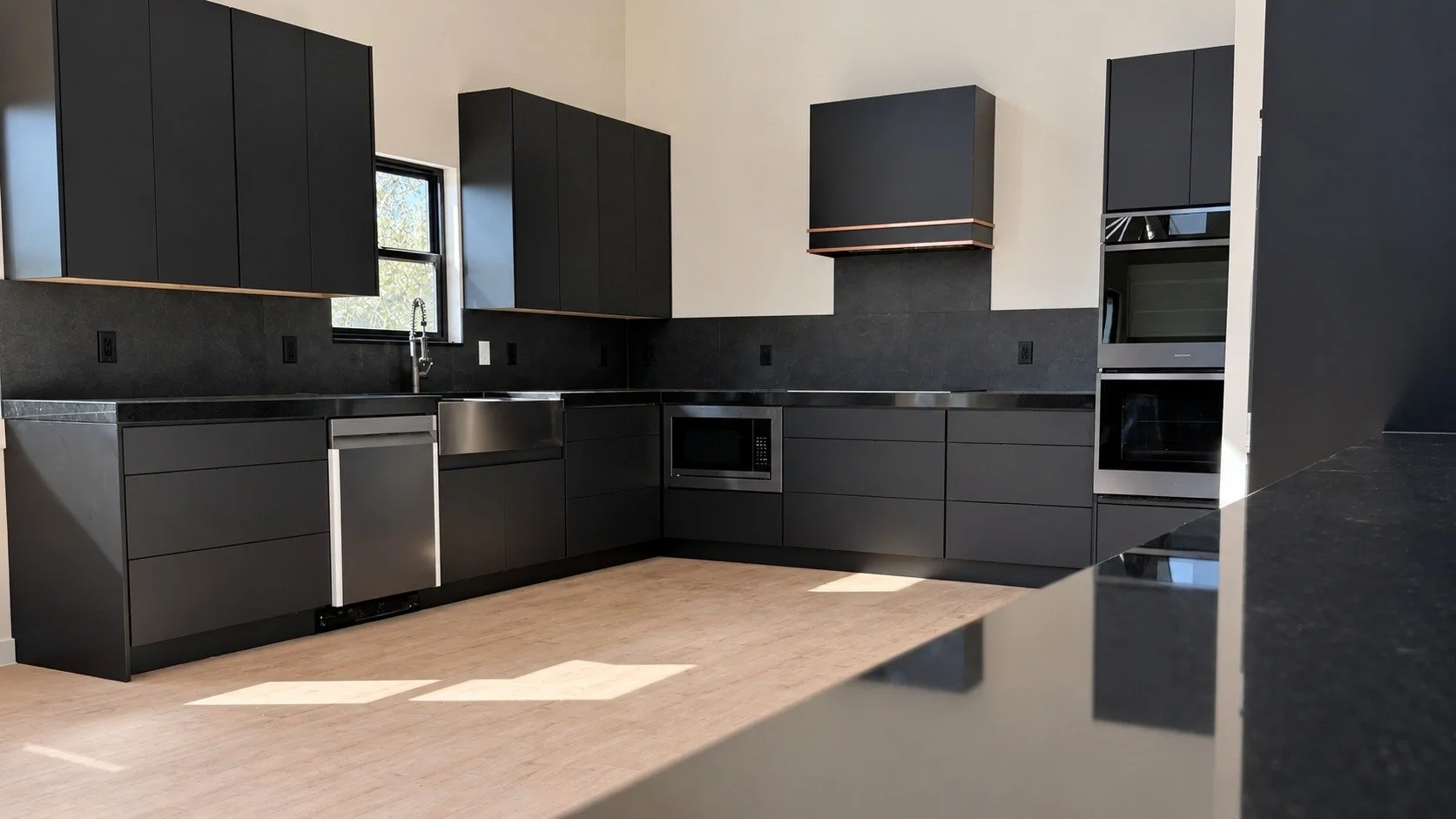 The full kitchen, with coordinated cabinetry and generous work surfaces.
