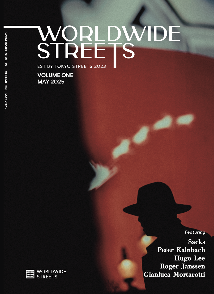 Cover of a magazine titled 'Worldwide Streets' featuring a silhouette of a person wearing a hat against an urban background with bright lights and blurry city elements, May 2025 issue.