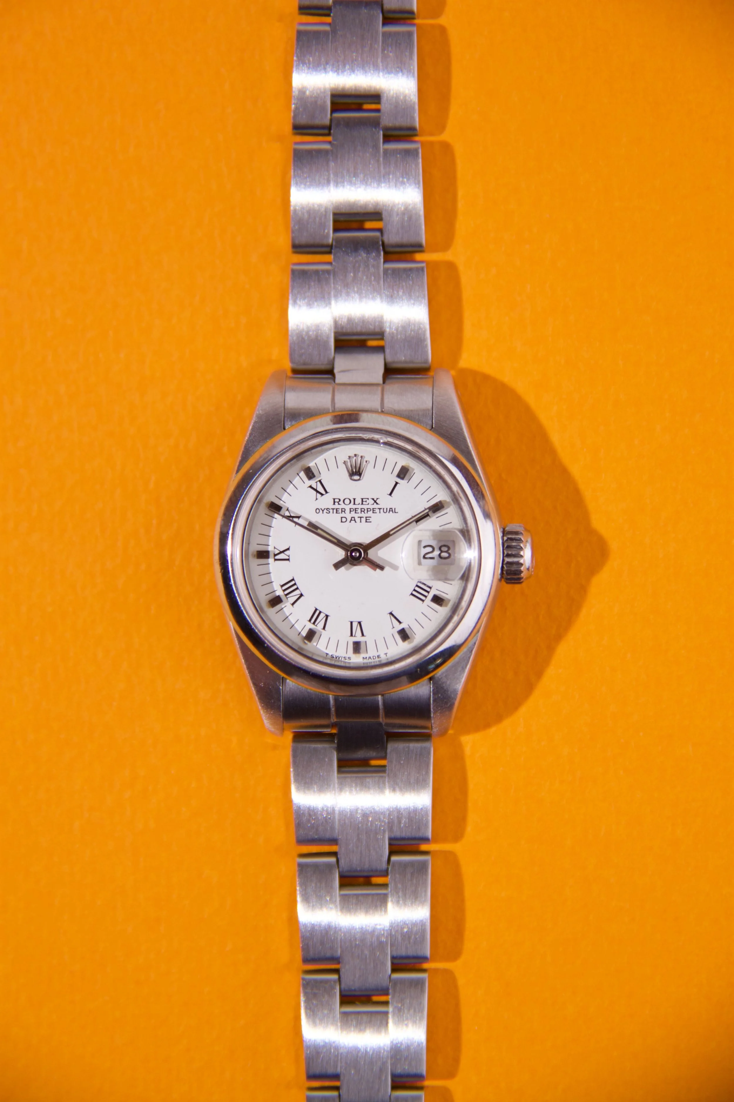 Rolex Oyster Perpetual Date chiffres Romain femme 26mm boite papier