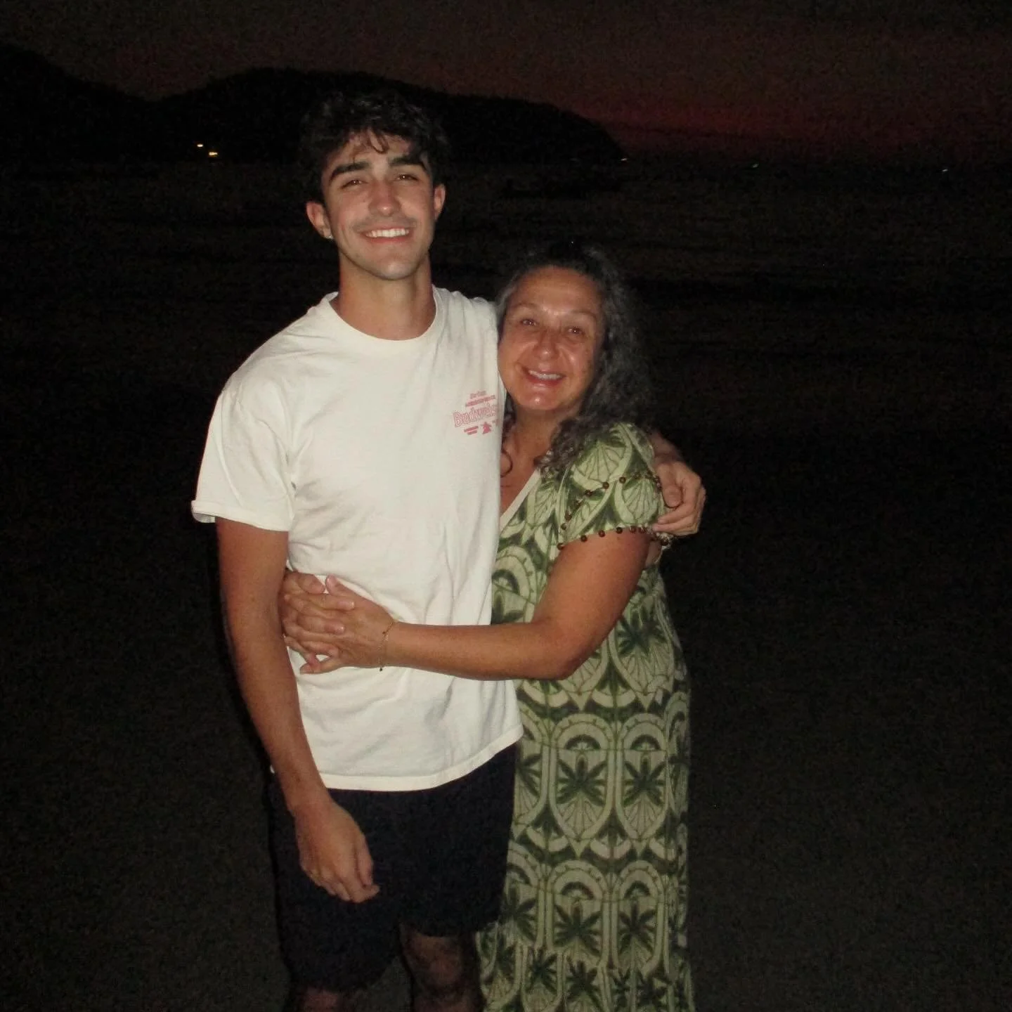 Lilac in the wild: Isaac and Pilar (in her favorite Ollari maxi) on La Ropa Beach in Zihuatanejo.