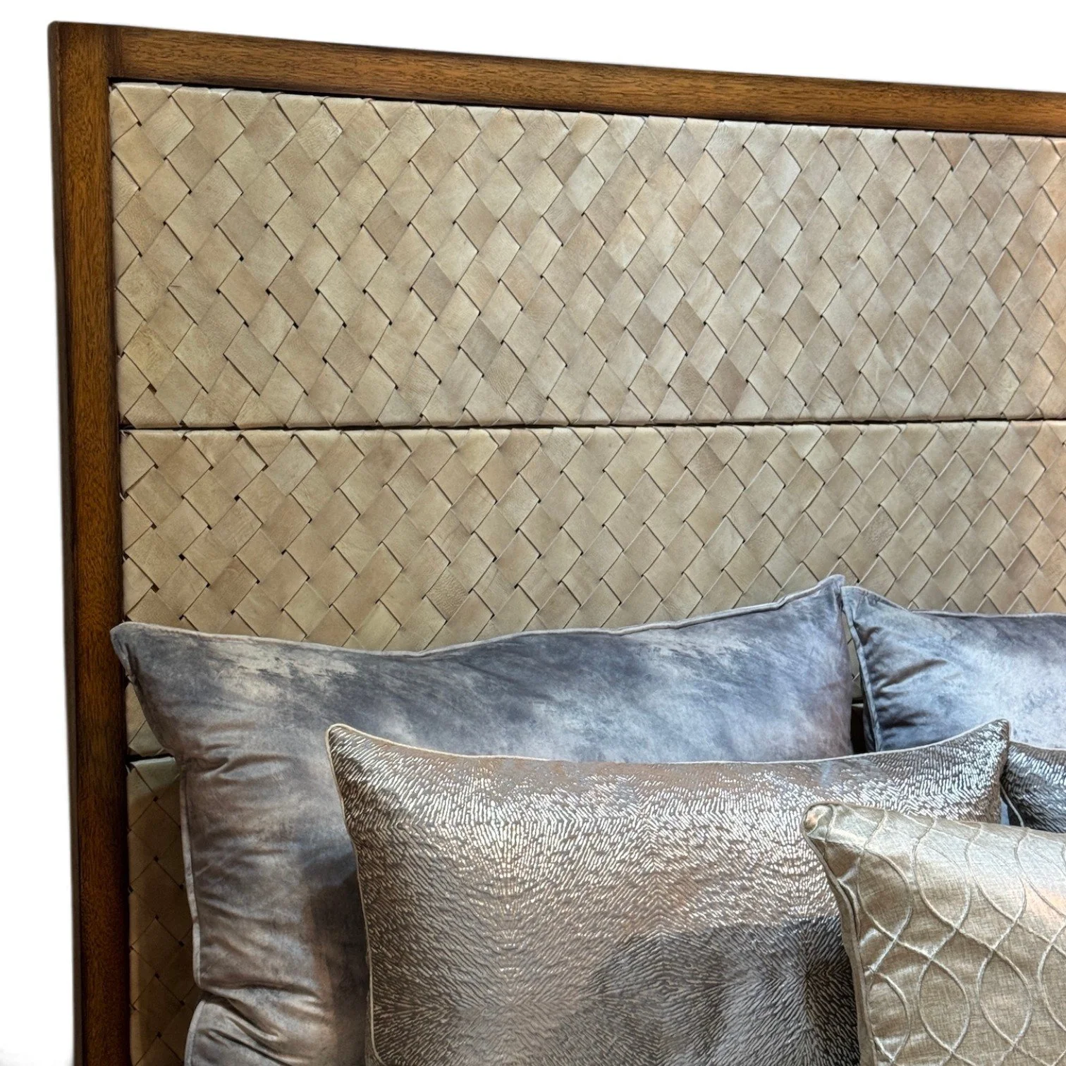 Handmade bed with hand-woven leather headboard framed in solid wood