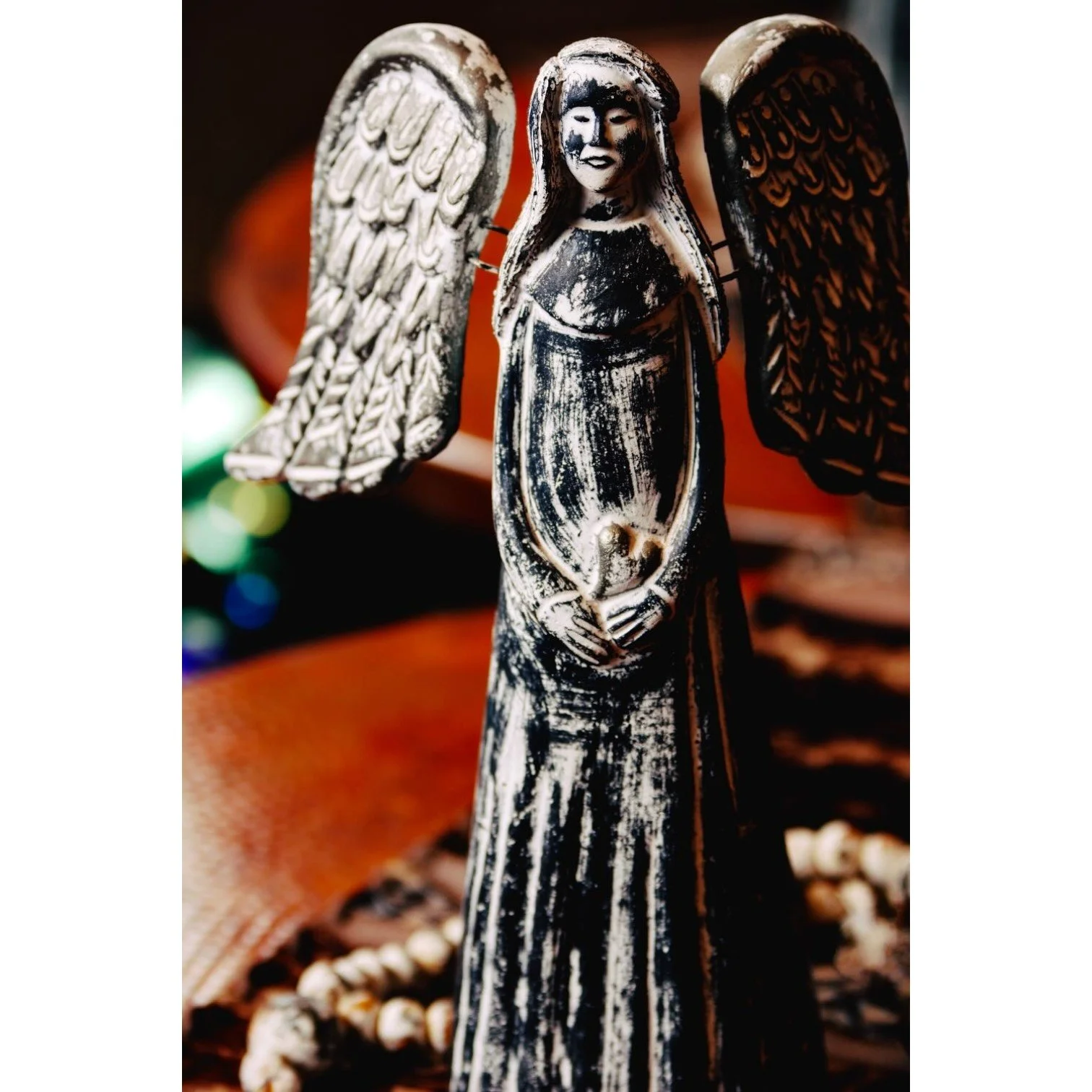 Handmade Angel y Corazón clay décor with distressed silver and white finish crafted in Mexico.