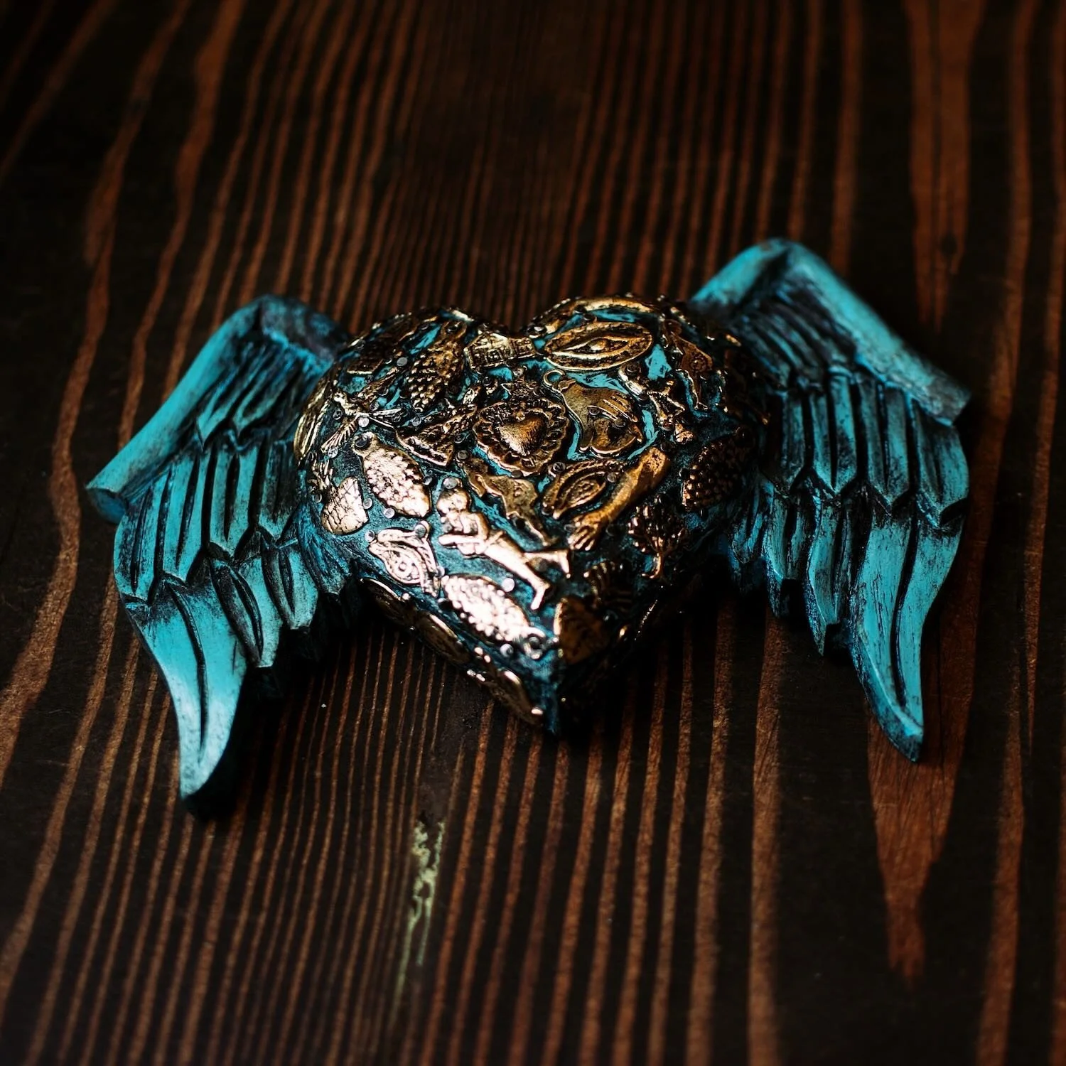 Handmade Mexican blue angel wings wall décor with traditional silver milagros charms.