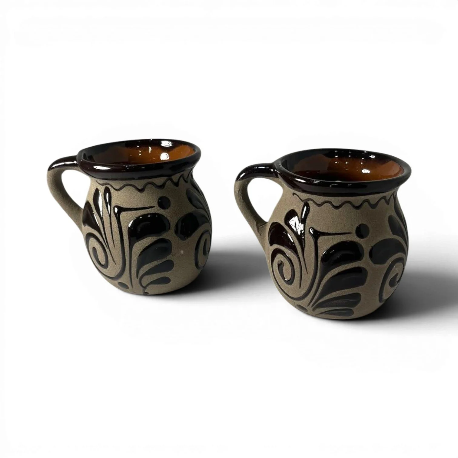 Handmade Mexican cocoa clay mug set with glazed rims and artisan interior and exterior design.