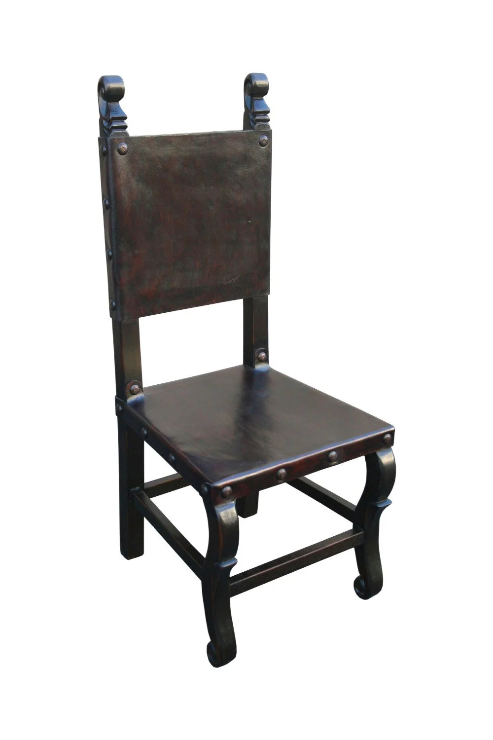 Shop the Belisario Leather Dining Chair Dark handmade in Peru. Dark leather, carved wood frame, and clavos trim for elegant Old World dining seating.