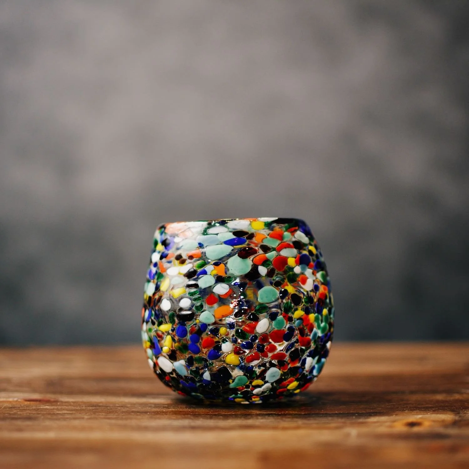 Handblown Mexican Guanajuato confetti glass with rounded base and colorful artisan finish.