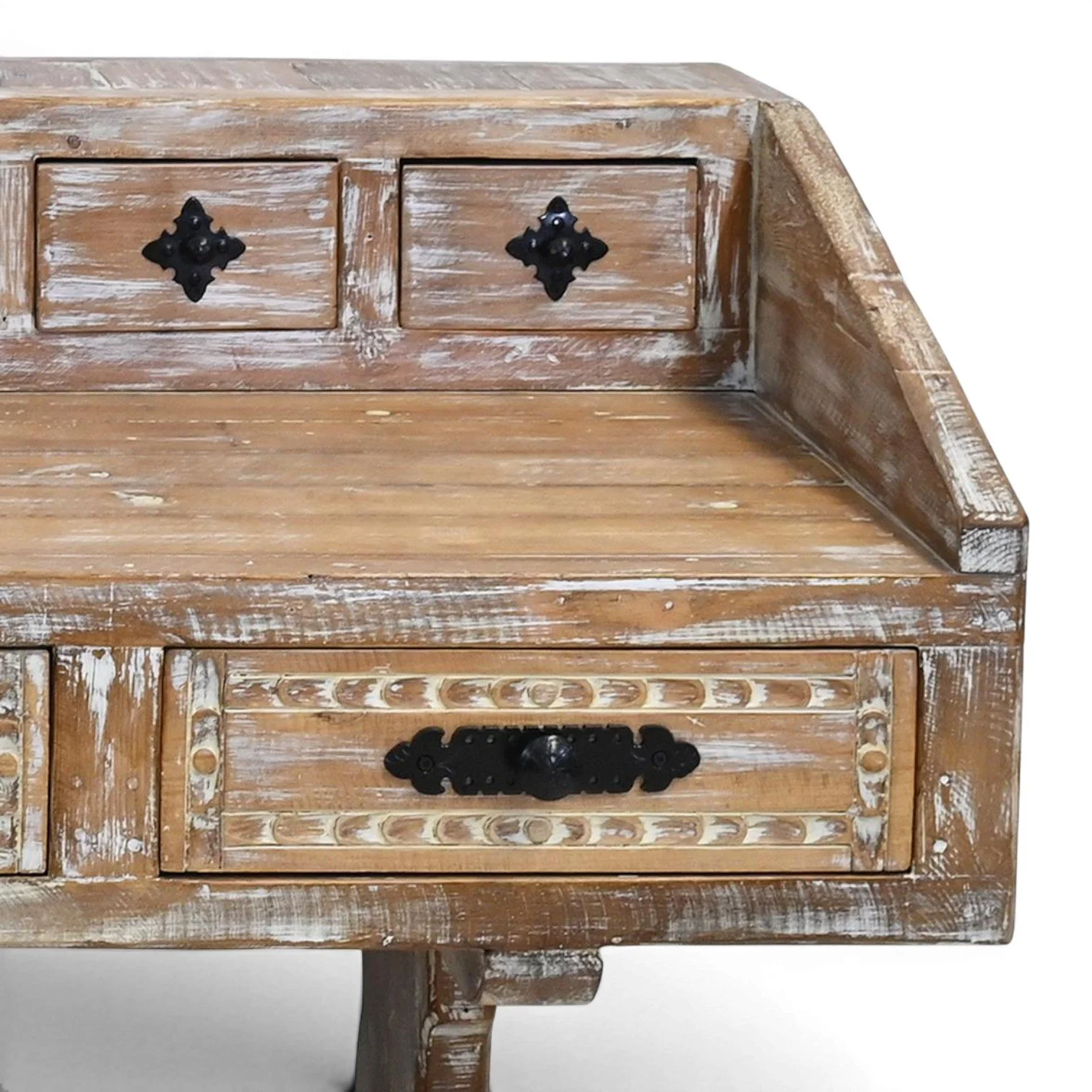 Handmade Mexican Las Carreras white washed desk with hand-carved details, iron hardware, and eight drawers
