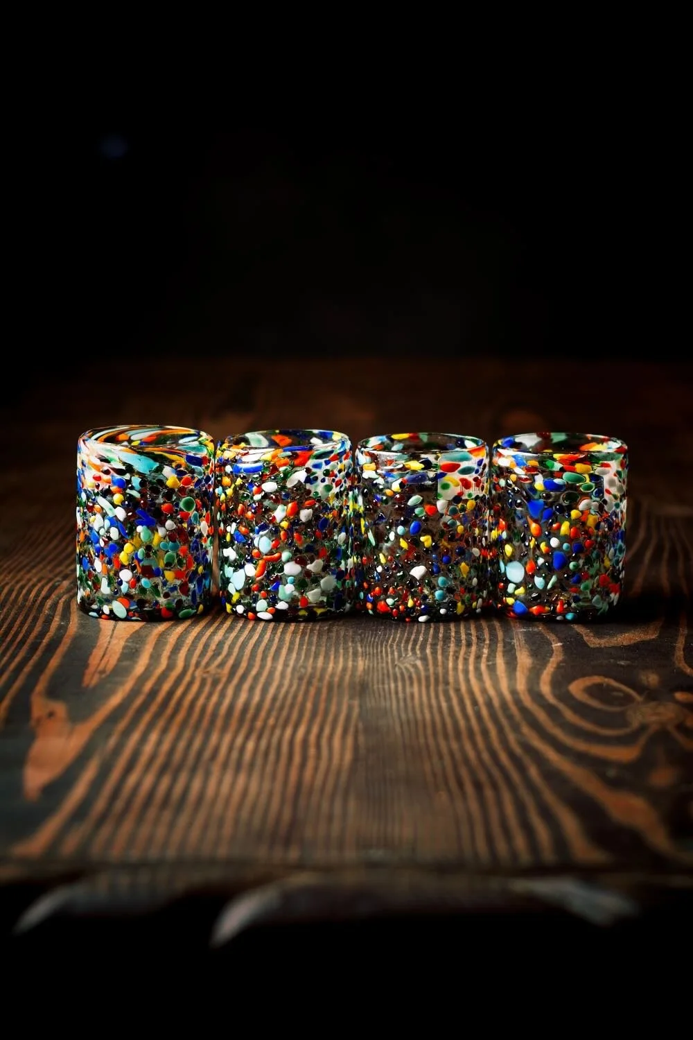 Shop a handblown Guanajuato tumbler from Mexico. Colorful confetti glassware perfect for everyday drinks, entertaining, and unique table settings.