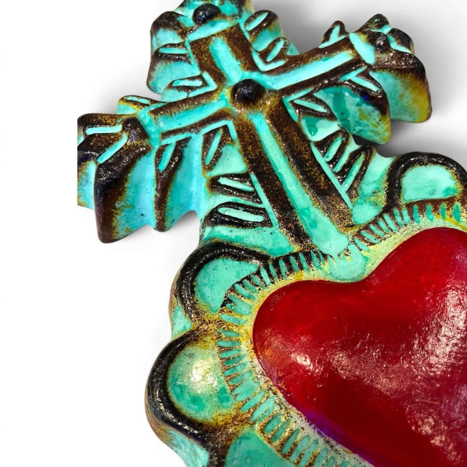 Handmade Mexican turquoise clay Sacred Heart wall décor featuring a vibrant turquoise finish with a bold red cross.