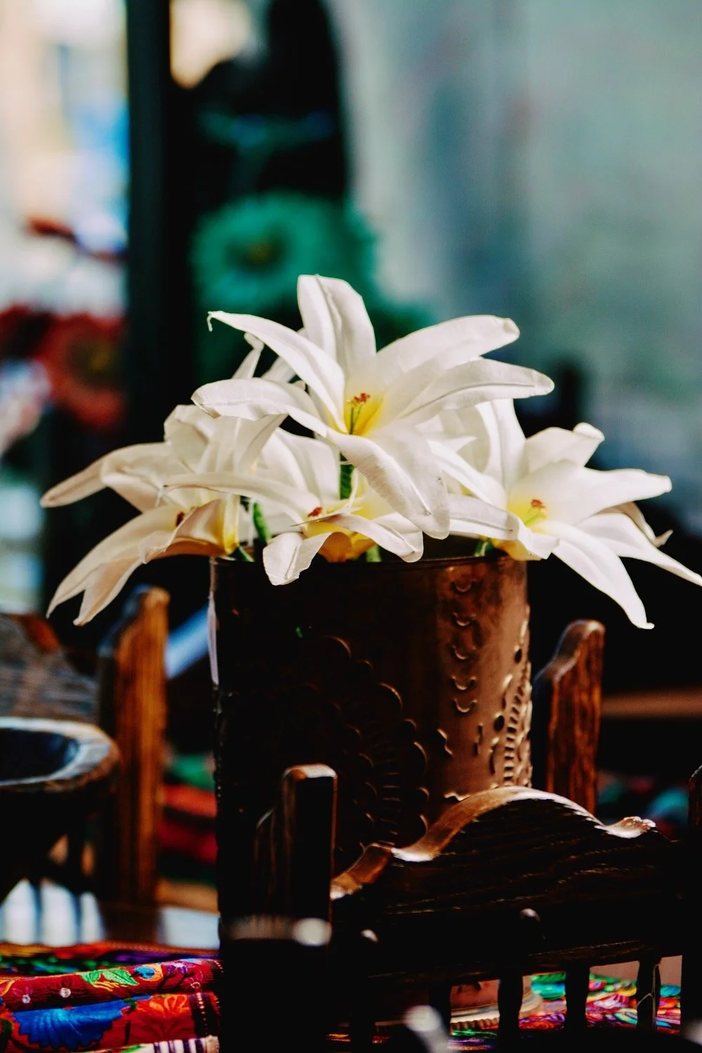 White cornhusk flowers and bronze luminaria from Mexico.