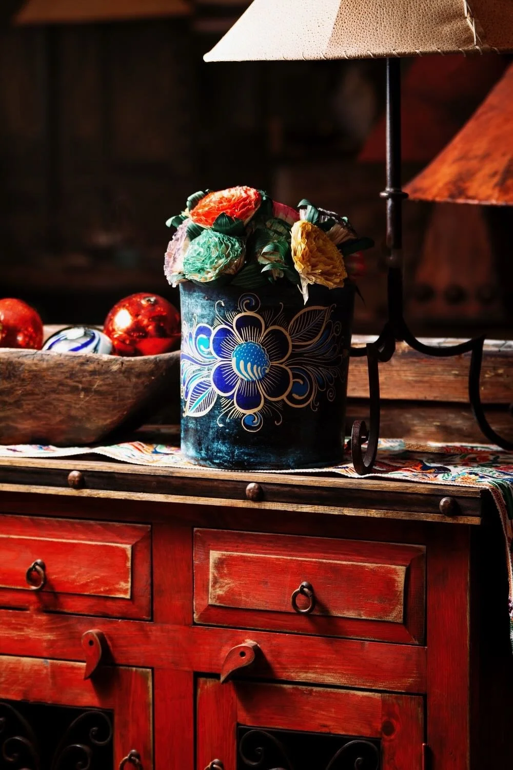 Rustic red buffet, clay potter and flowers from Mexico
