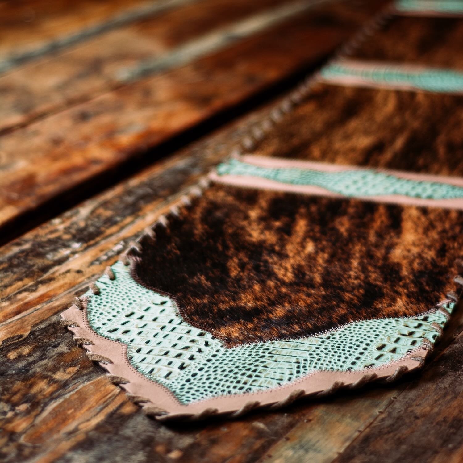 Tooled leather and cowhide table runner from Brazil