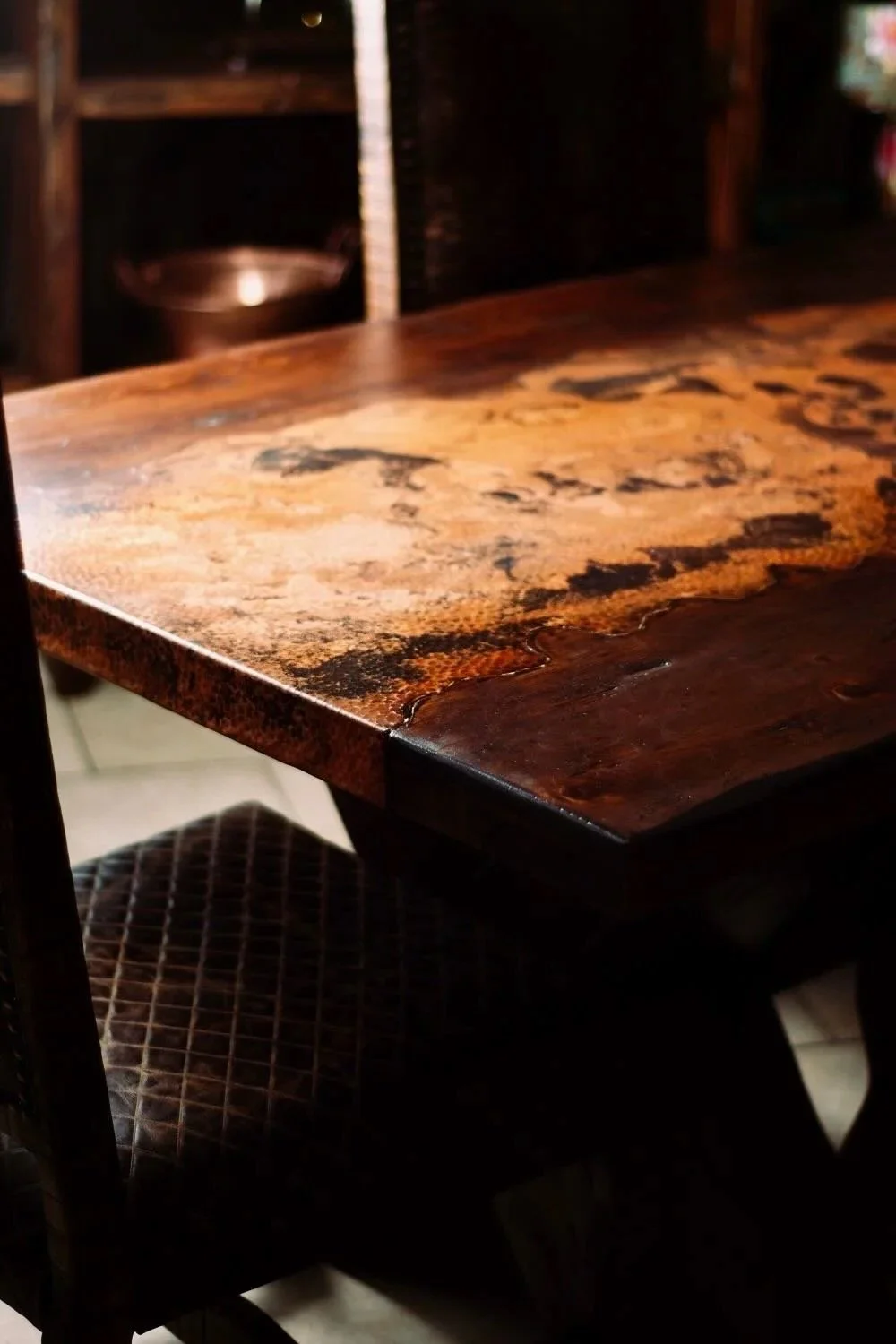 Artesia Leather Dining Table handcrafted in Mexico with reclaimed wood top, crocodile-embossed leather inlay, and X-base design seating up to 10.