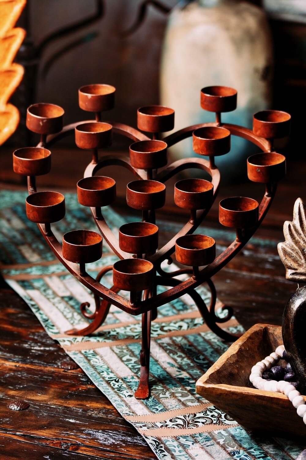 Add artisanal charm to your home with the Candelabro Elegante de Corazón, a handmade wrought iron candelabra from Mexico.