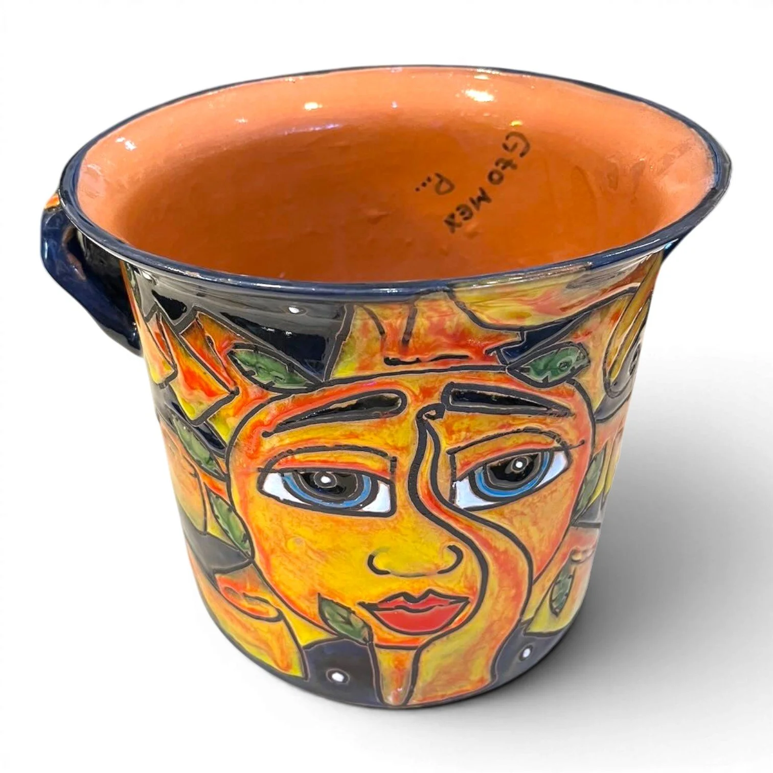 Handmade Jarrón del Sol glazed clay planter with hand-painted sun design in cobalt blue, orange, and yellow.