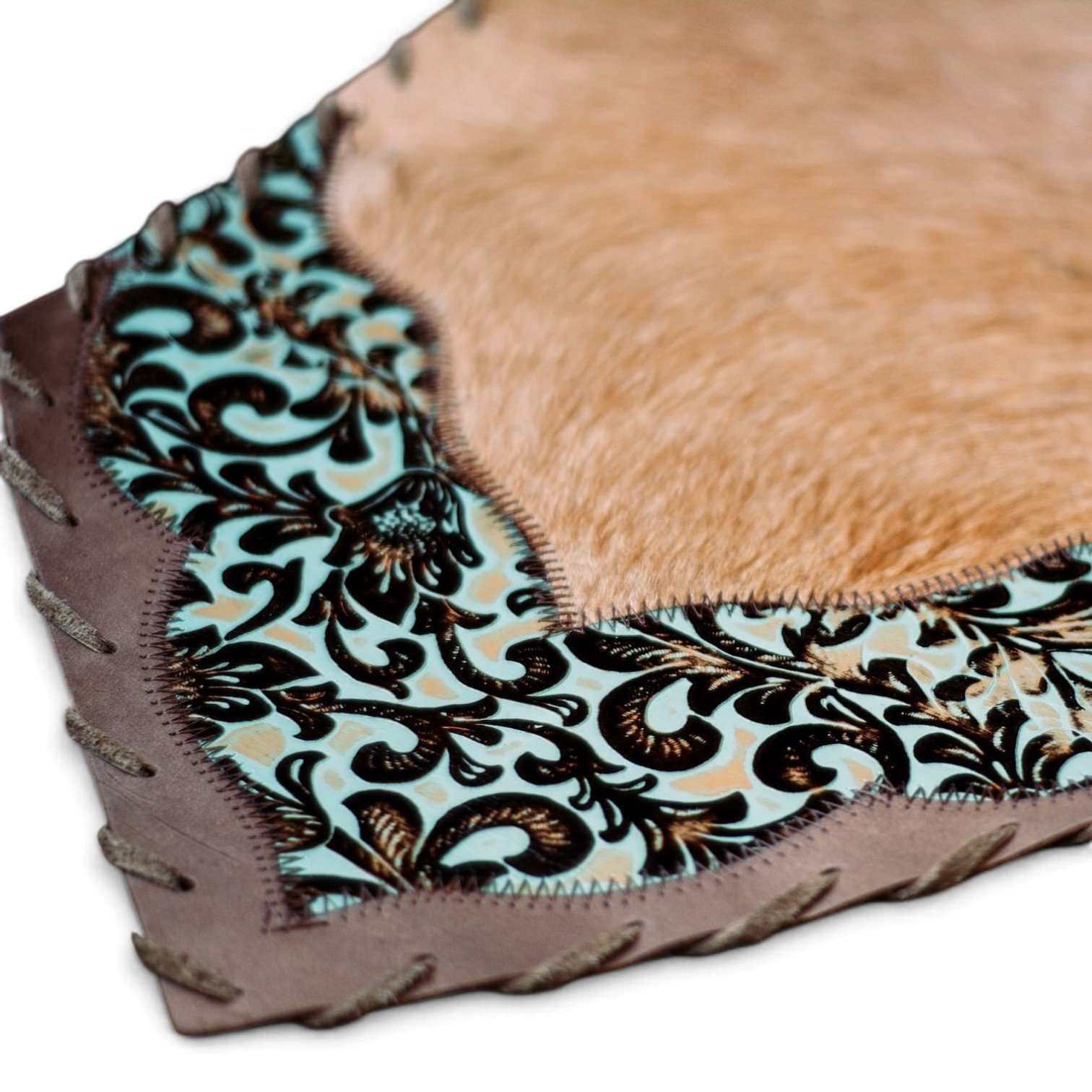 Handmade Brazilian cowhide table runner with tooled leather.