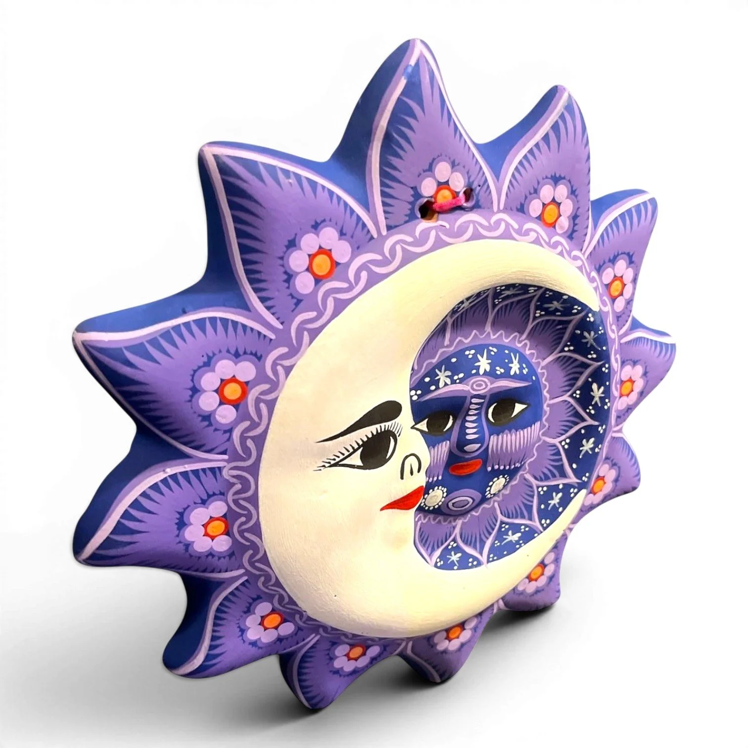 Handmade Arcilla Sol y Luna clay wall art from Oaxaca, Mexico featuring a colorful hand-painted sun and moon design.