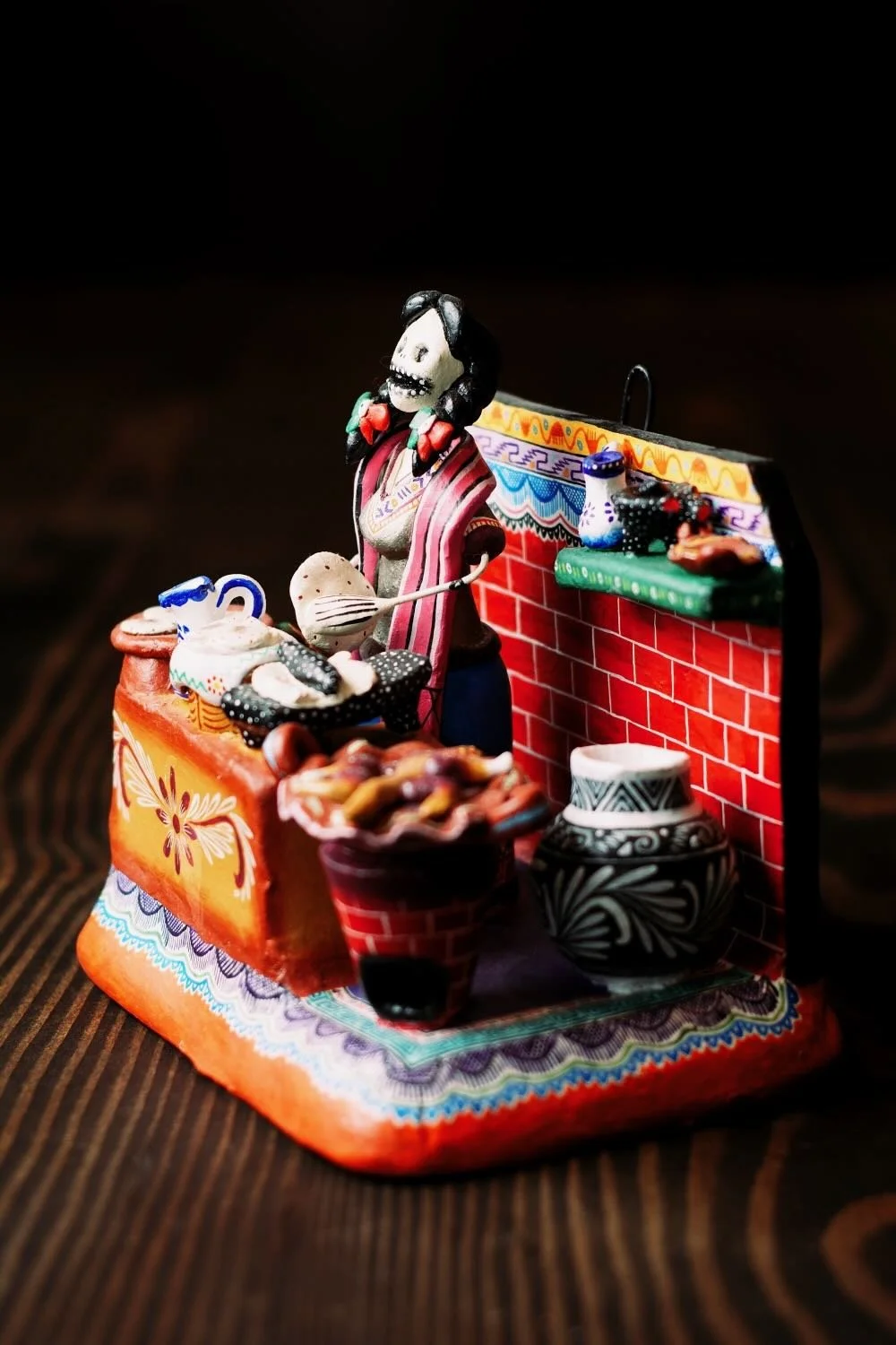 Shop a handmade Catrina kitchen scene from Mexico. Colorful clay folk art featuring a tortilla-making Catrina, perfect for unique decor displays.
