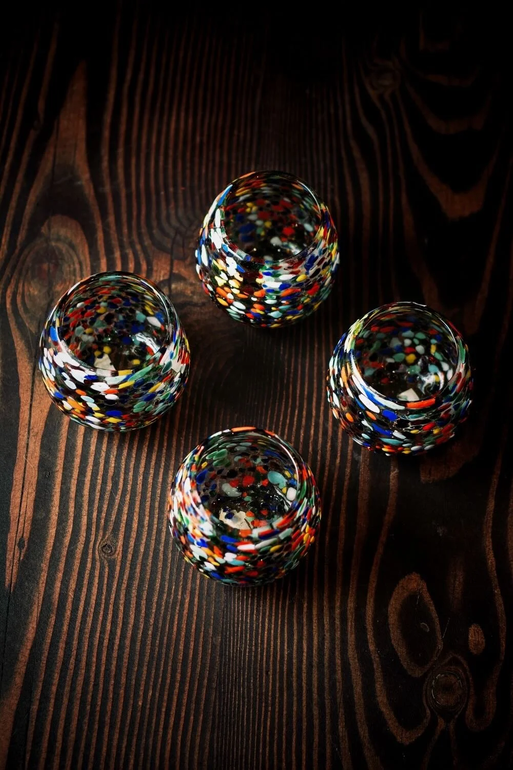 Shop a handblown Guanajuato glass from Mexico. Colorful confetti design artisan drinkware perfect for everyday use or entertaining.