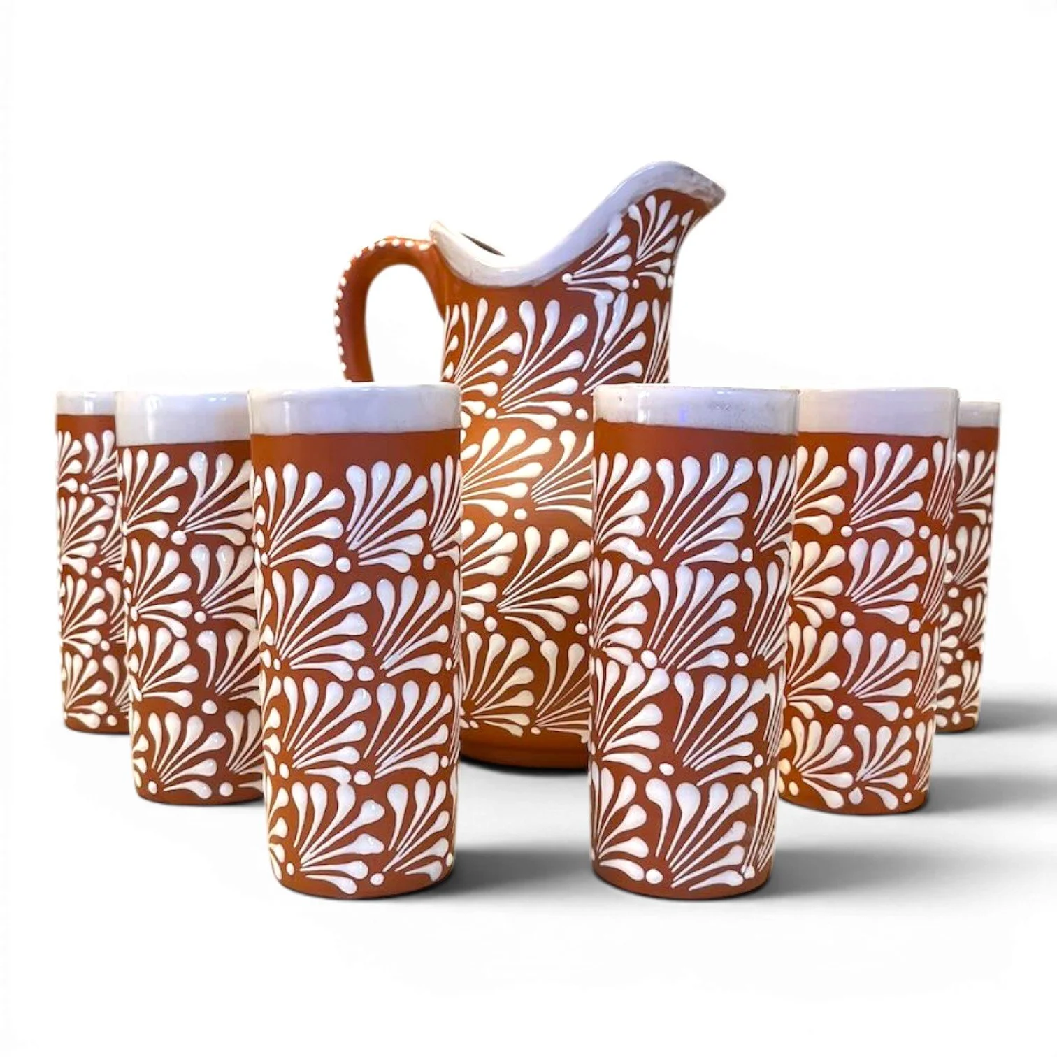 Handcrafted Mexican terracotta pitcher and tumbler set with white Talavera-style design and glazed finish