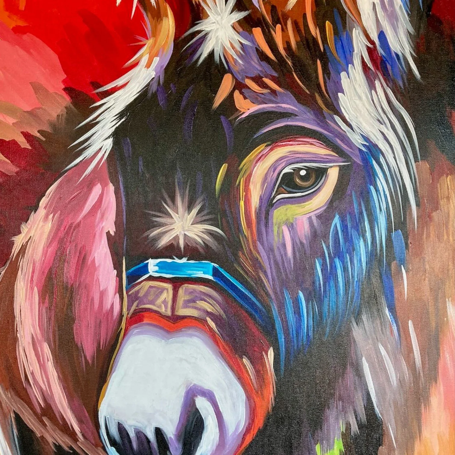 Hand-painted Mexican canvas featuring a colorful donkey in a joyful fiesta-inspired scene