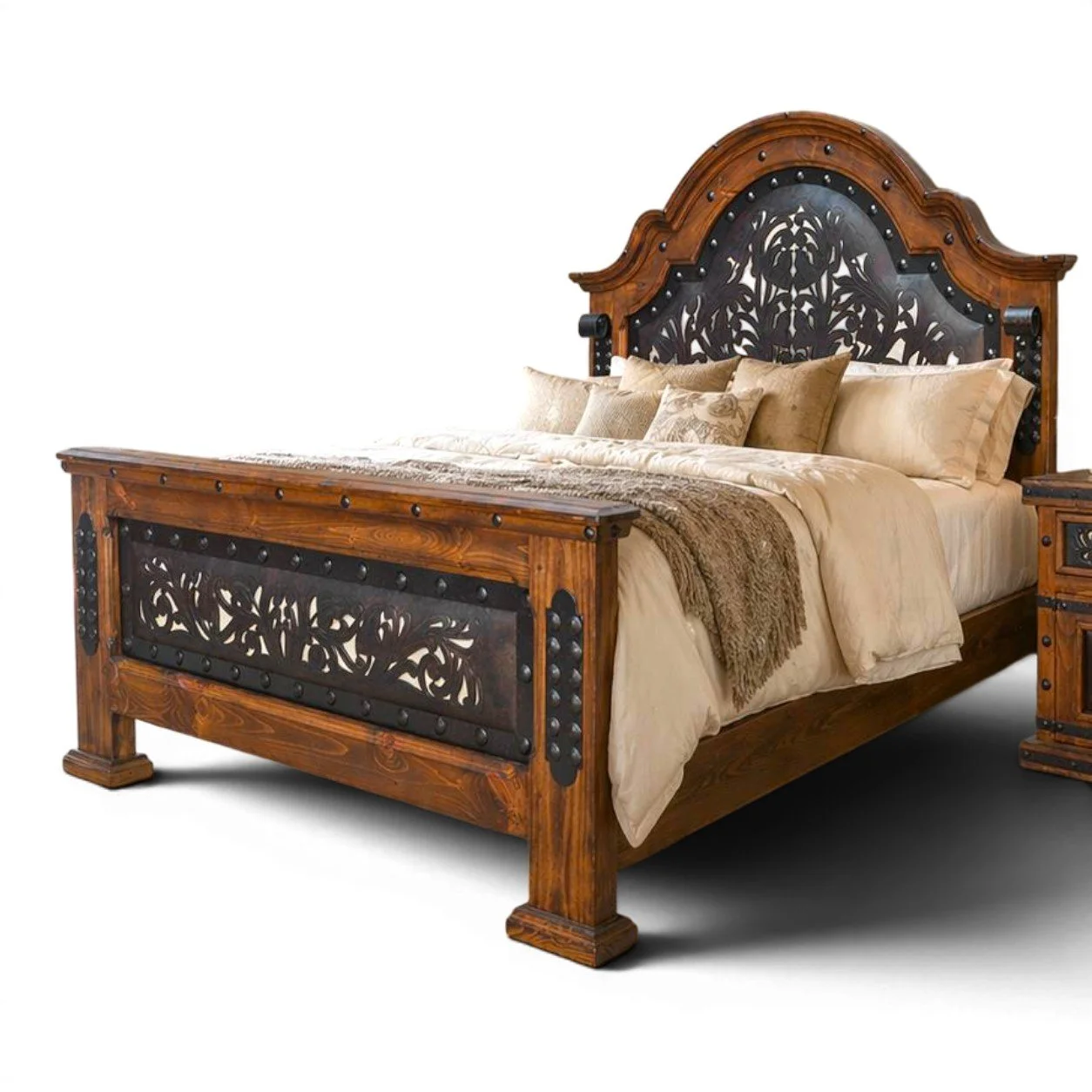 Handmade Arco de Herradura Western bed with arched headboard, tooled and perforated leather panels, carved wood, iron trim, and clavos.