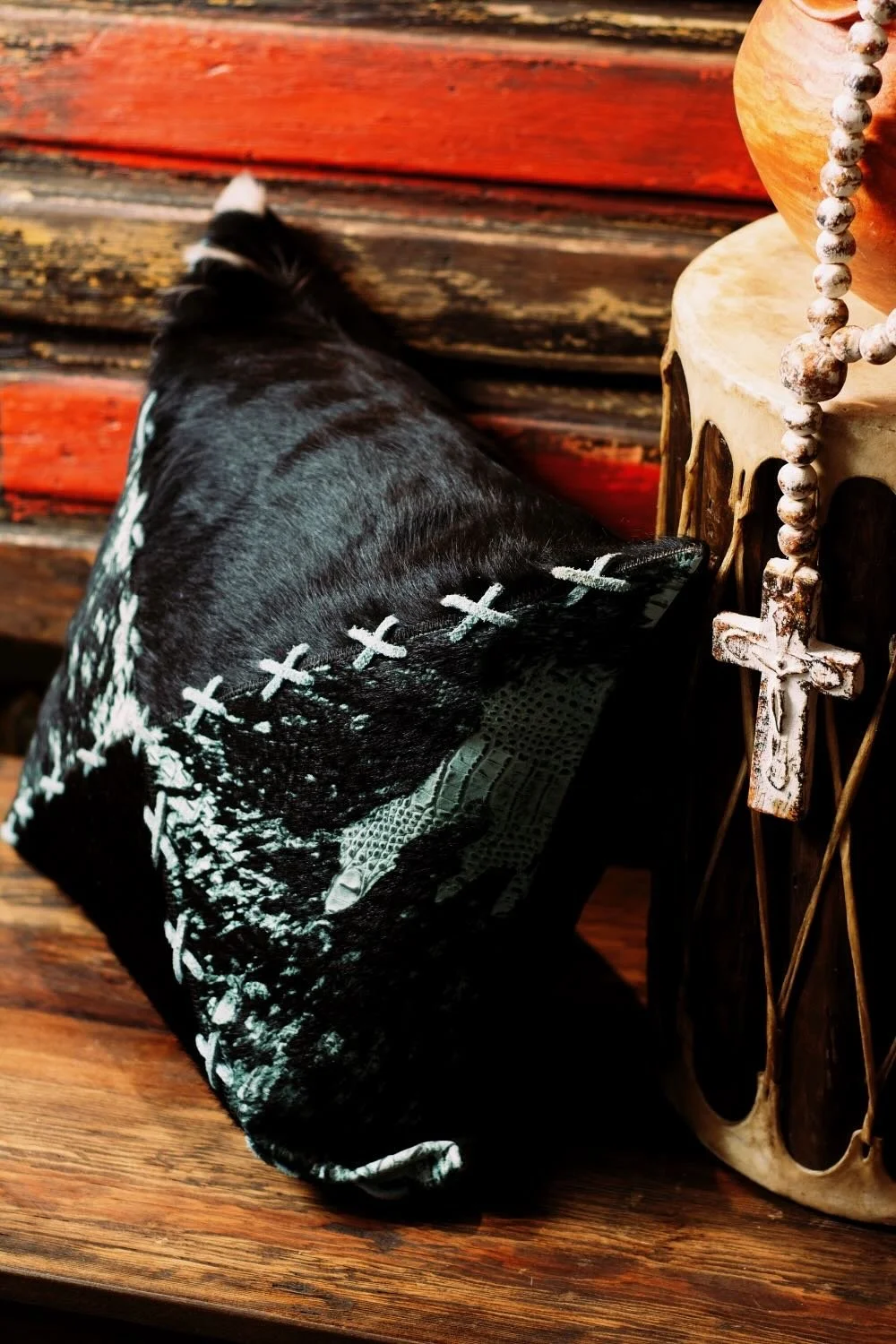Shop a handmade cowhide and leather pillow from Brazil. Rustic luxury accent pillow with unique patterns for sofas, chairs, and home decor.