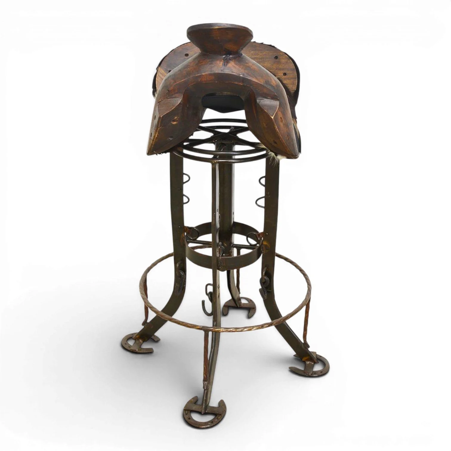 Handmade Sonora Western cowhide saddle bar stool with hand-carved wood, iron swivel base, and horseshoe footrests crafted in Mexico.