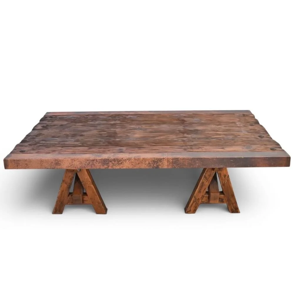 Handmade Floresville copper edge coffee table with A-frame base, distressed wood top, and clavos accents.