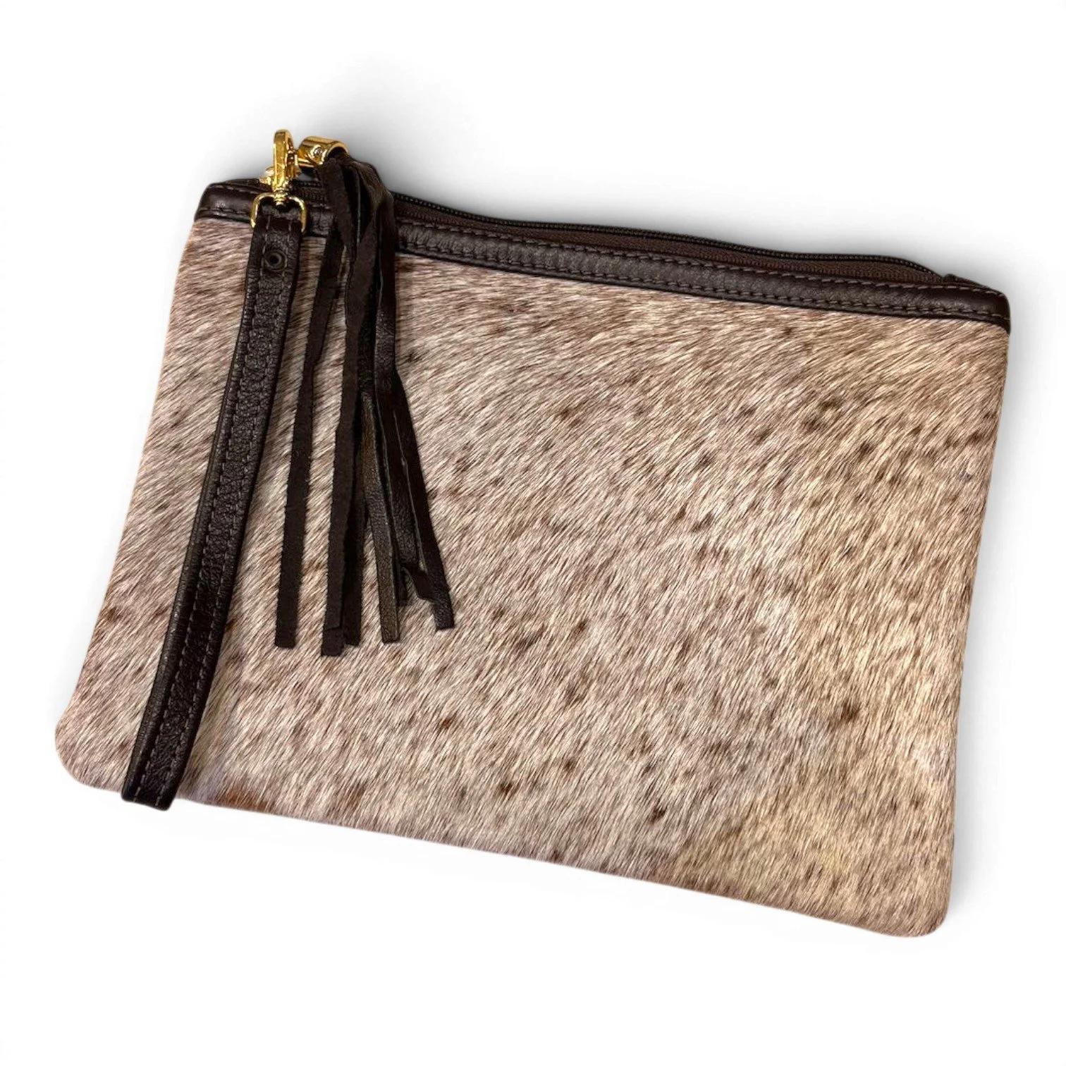 Handmade Brazilian cowhide clutch with fringe detailing, zipper closure, and wrist strap