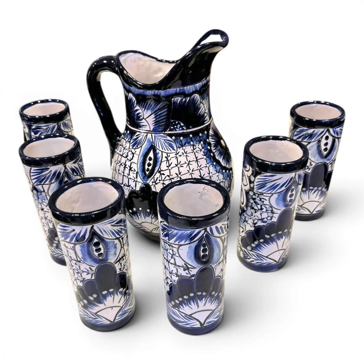 Handmade Mexican blue and white Talavera pitcher with six matching hand-painted tumblers.