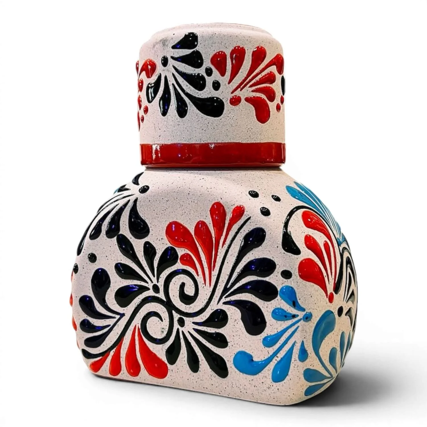Handmade Mexican stone tequila bottle and matching shot cup with colorful hand-painted design
