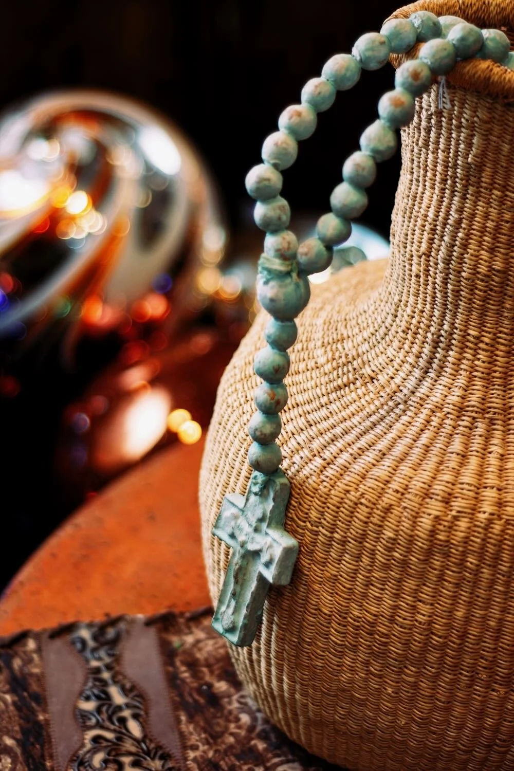 Rosario de Barro - Turquesa. Handcrafted 27" turquoise clay rosary from Milagros Rústicos. Features a distressed finish. Ideal for home altars or rustic decor.