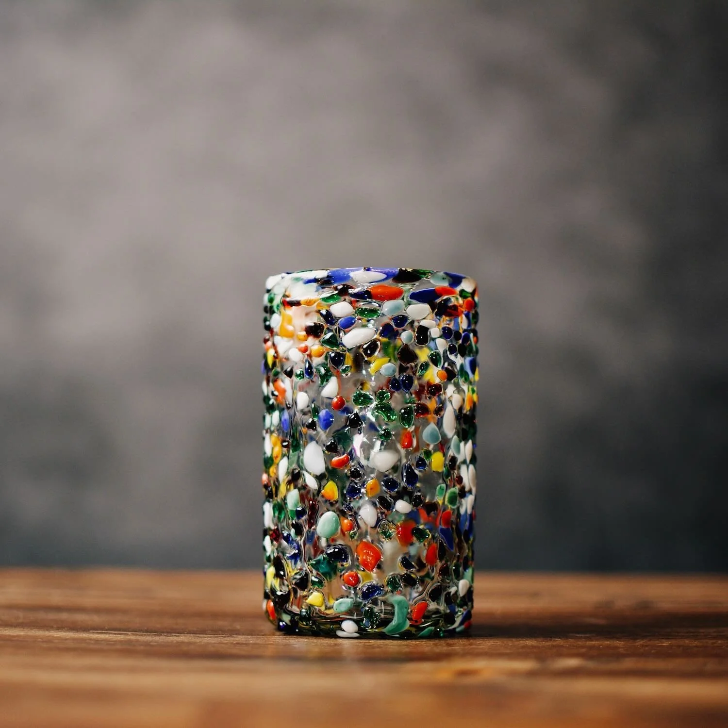 Handblown Mexican Guanajuato tall tumbler with colorful confetti glass and textured artisan finish.