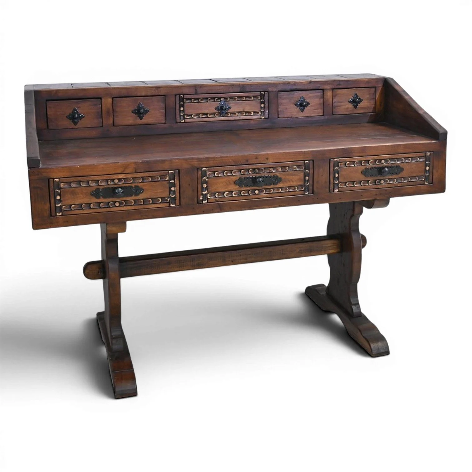 Handmade Mexican Las Carreras dark stained desk with hand-carved details, iron hardware, and multiple drawers