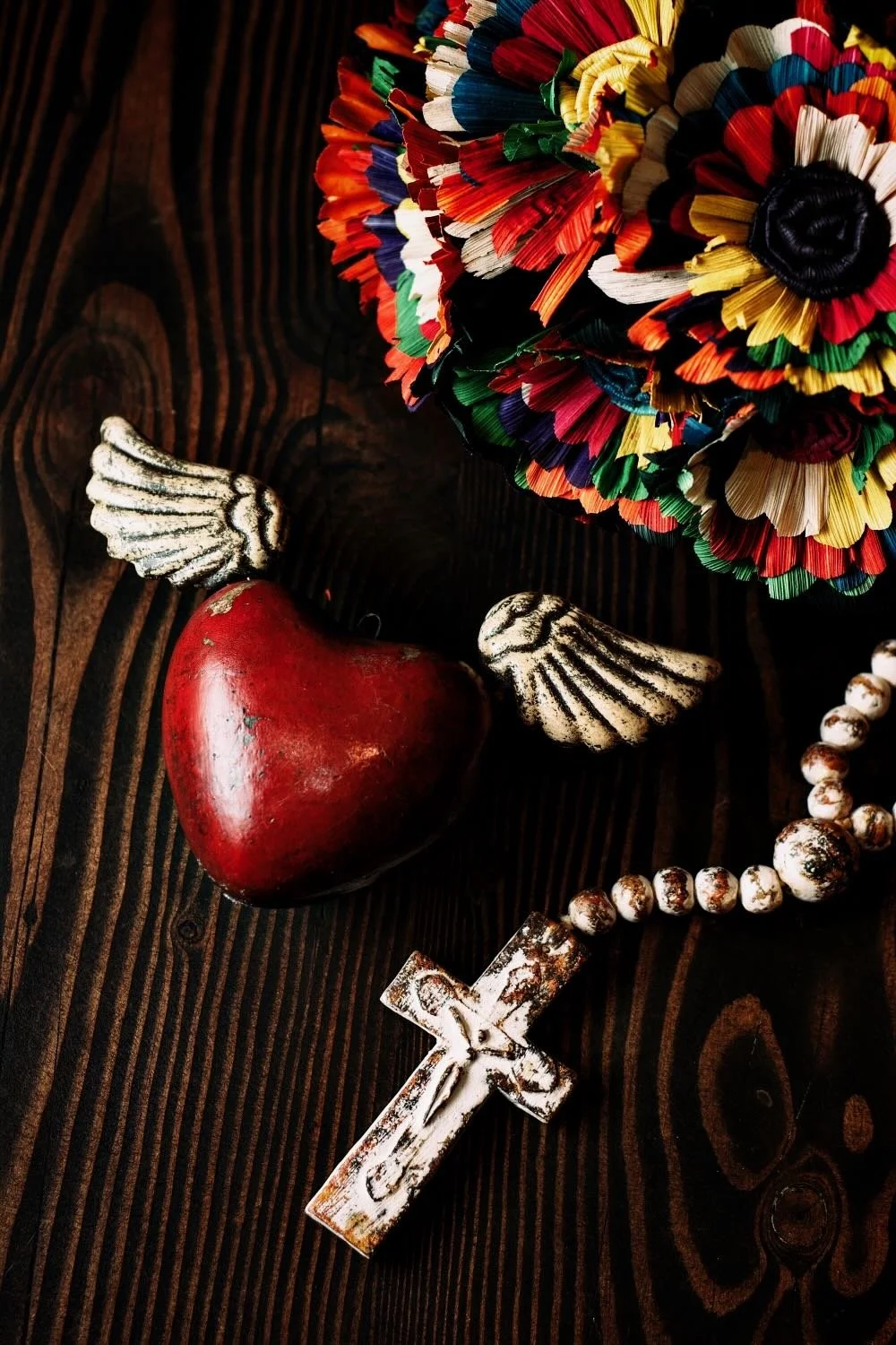 Shop a handmade sacred heart with wings from Mexico. Unique clay decor with spiritual symbolism and artisan craftsmanship for home accents.