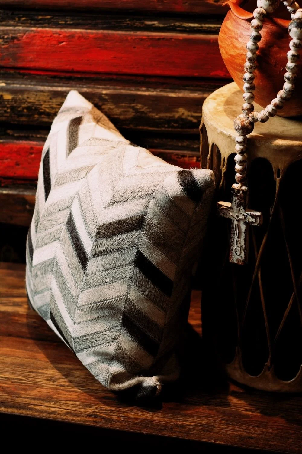 Shop a handmade cowhide and leather pillow from Brazil. Rustic luxury accent pillow with unique patterns for sofas, chairs, and home decor.