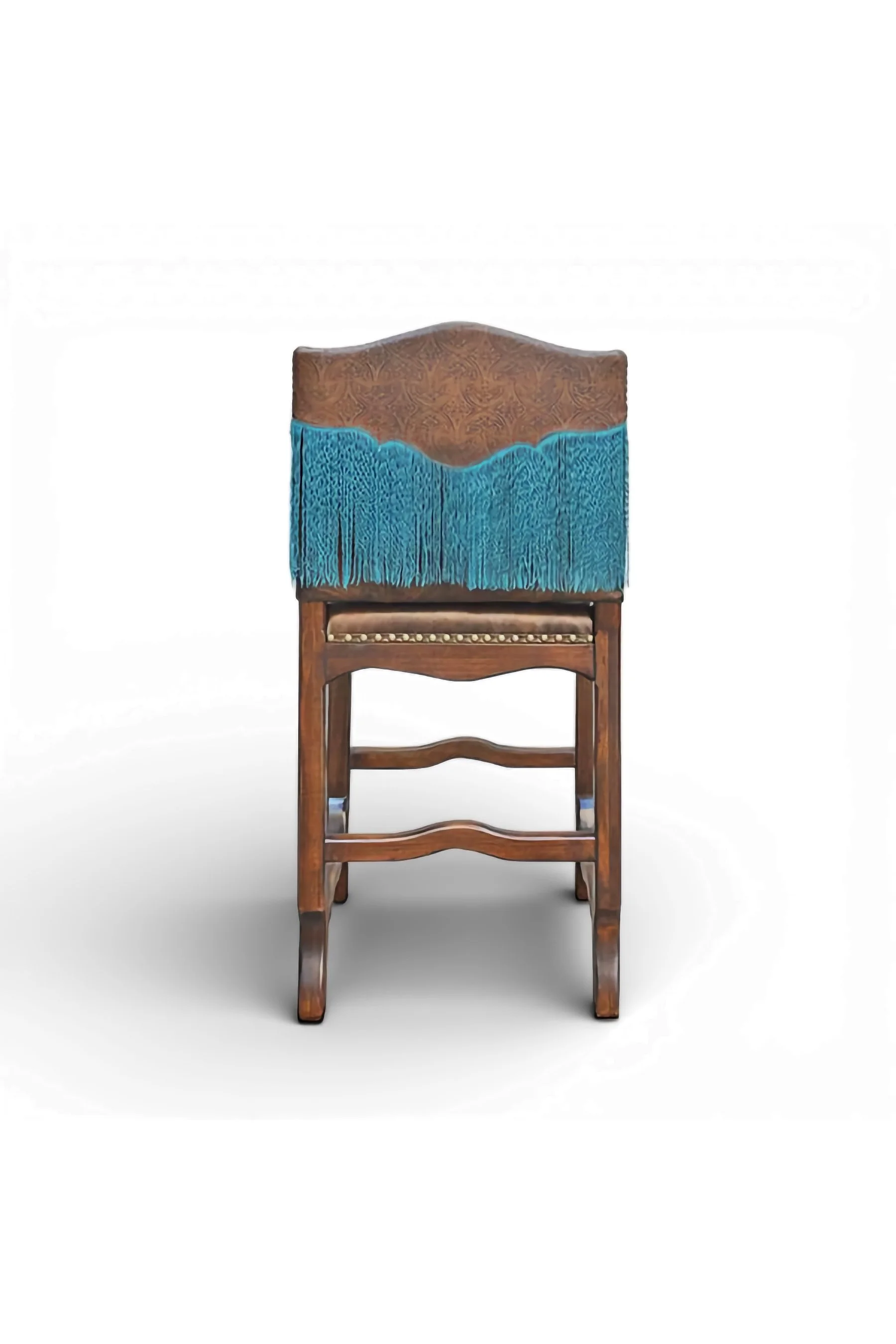 Shop a handmade leather bar stool with turquoise fringe from Mexico. Rustic Southwestern seating with carved wood and bold artisan detail.