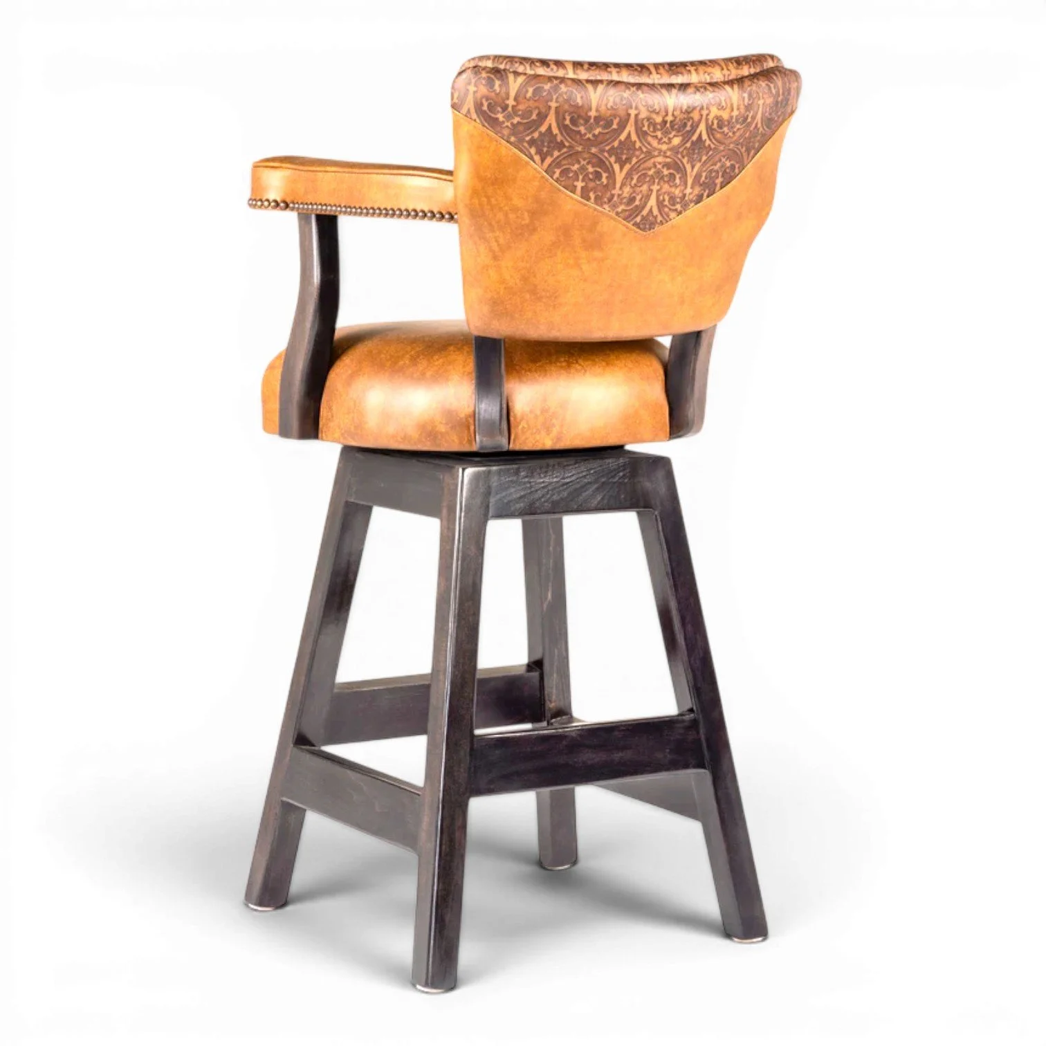 Handcrafted Tombstone Western leather bar stool with top-grain leather upholstery, solid hardwood frame, and decorative nailhead trim.