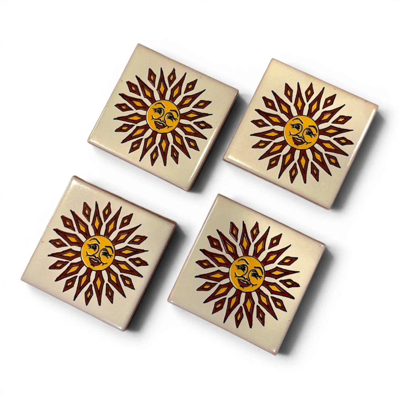 Set of four colorful Talavera tile coasters with hand-painted Mexican pottery designs