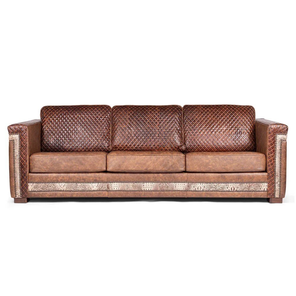 The Carson City Quilted Sofa with Croc Angle Leather features premium top-grain leather, croc-textured accents, quilted detailing, and handcrafted Western design for bold luxury and comfort.