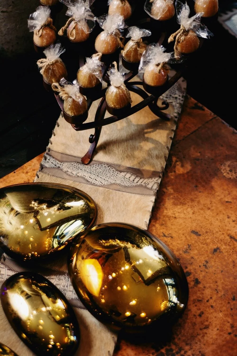 Hand pounded copper coffee table, iron candelabra and hand blown glass art from Mexico.