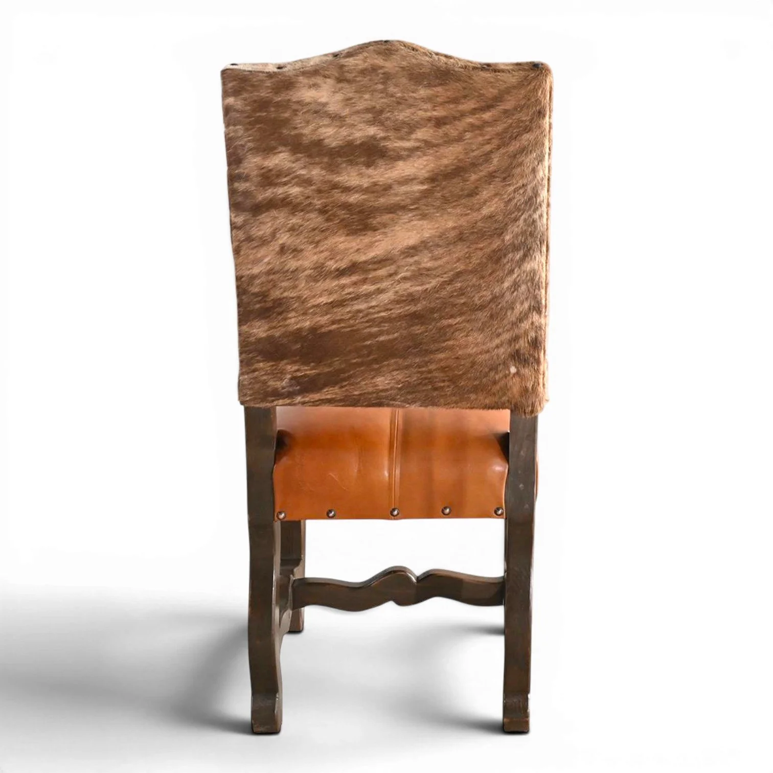 Handmade San Lucas terracotta leather and genuine cowhide dining chair with dark wood frame and decorative nailhead trim crafted in Mexico.